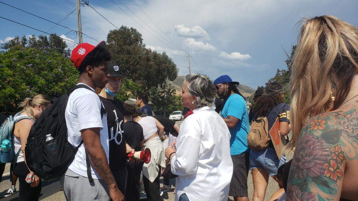San Luis Obispo Mayor Heidi Harmon talks with protesters during an anti-racism march through SLO on June 3, 2020.