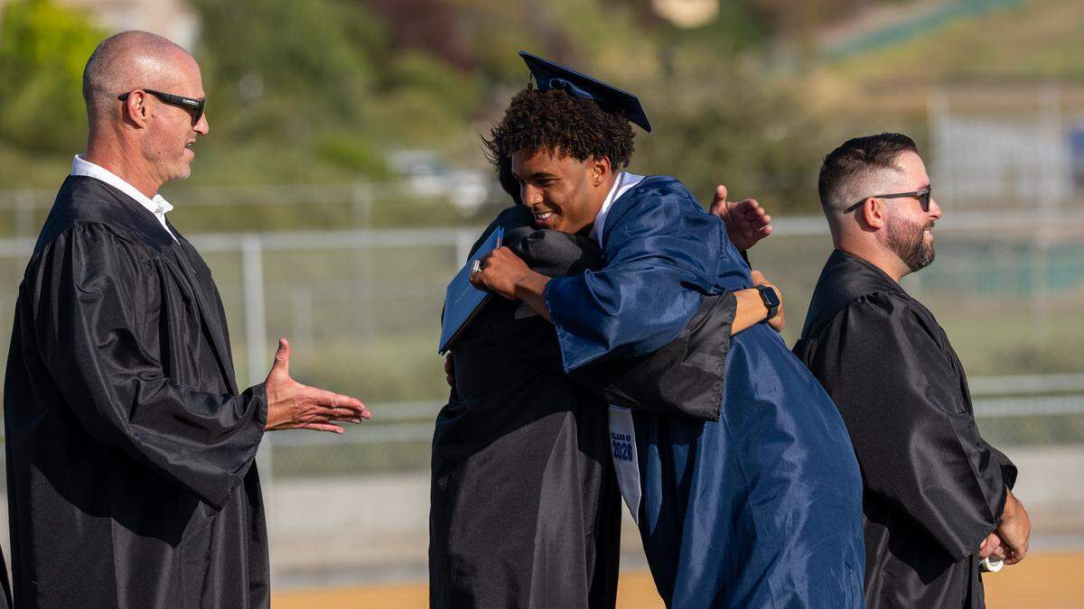 Arroyo Grande High School graduate Caleb Clark greets staff during graduation ceremonies on Thursday, June 4, 2026. A class of 443 seniors walked the stage at Doug Hitchen Stadium.