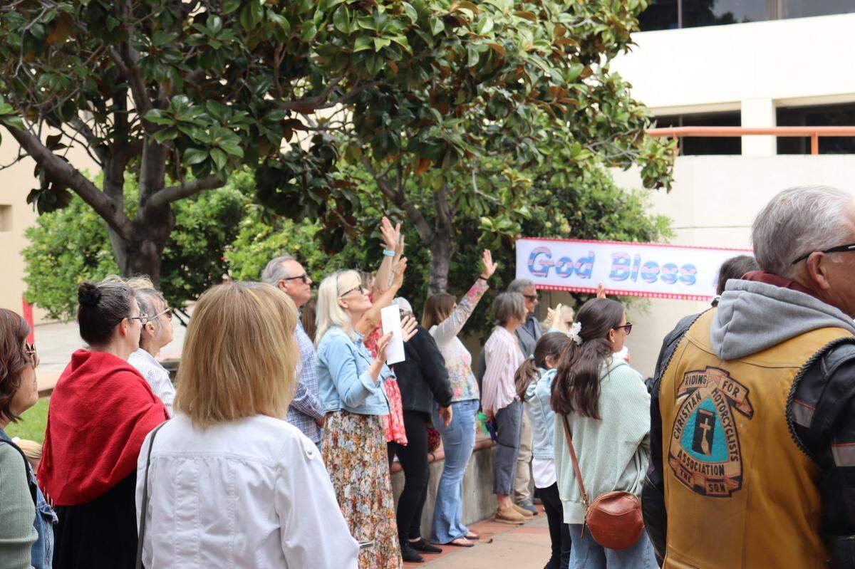 Over a hundred people gathered on the steps of the San Luis Obispo Superior Courthouse to celebrate the National Day of Prayer on Thursday, May 1, 2025, an event led by District Attorney Dan Dow.