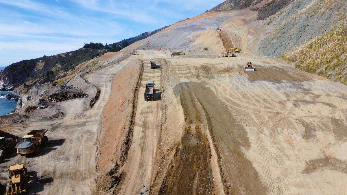 Crews continue to build up the elevation of the south end of Paul’s Slide on Highway 1 to Big Sur for what will be the new course of the roadway after winter storms cause the hillside to collapse. Caltrans shared this photo on Nov. 14, 2023.