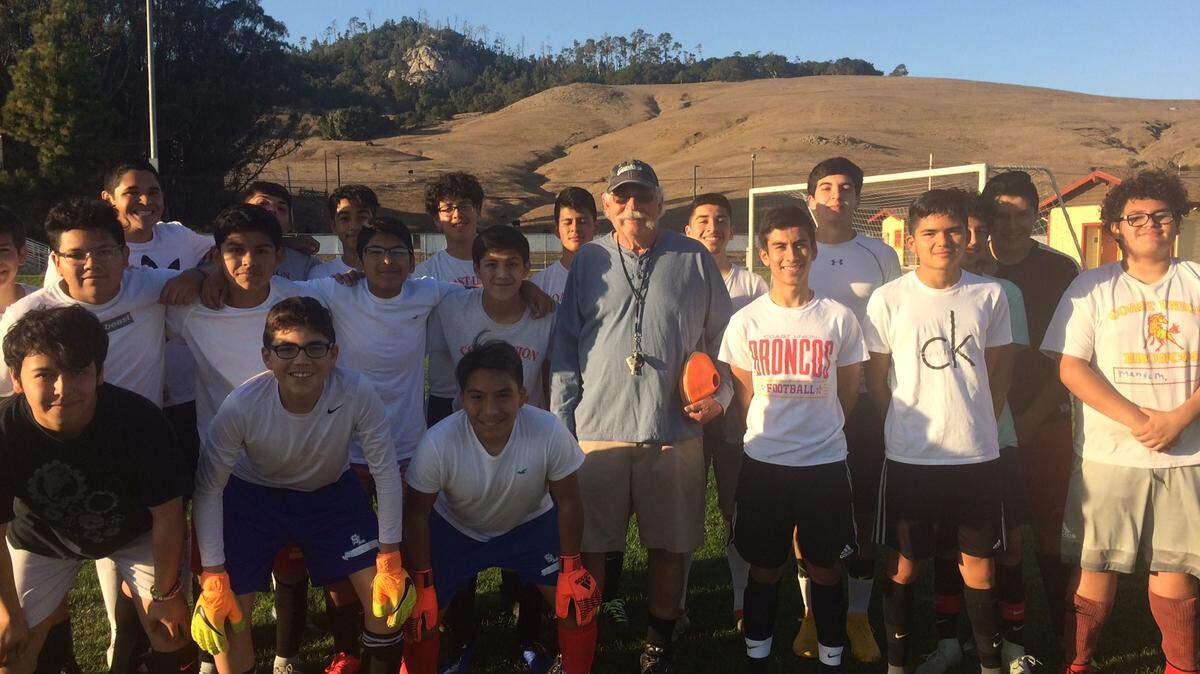 Coast Union High School boys soccer coach Jack Mettier (center) poses with his 2018-19 squad.