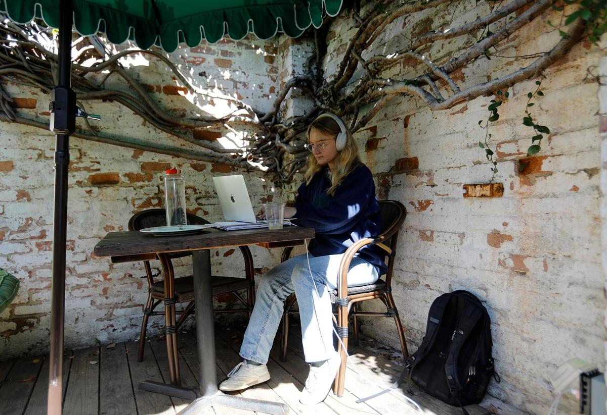 A students takse advantage of the relaxed atmosphere at Linnaea’s Cafe to do some school work. Linnaea’s, which opened in San Luis Obispo in 1984, has been owned by Rusty and Alex Quirk, a husband and wife team, since 2023.