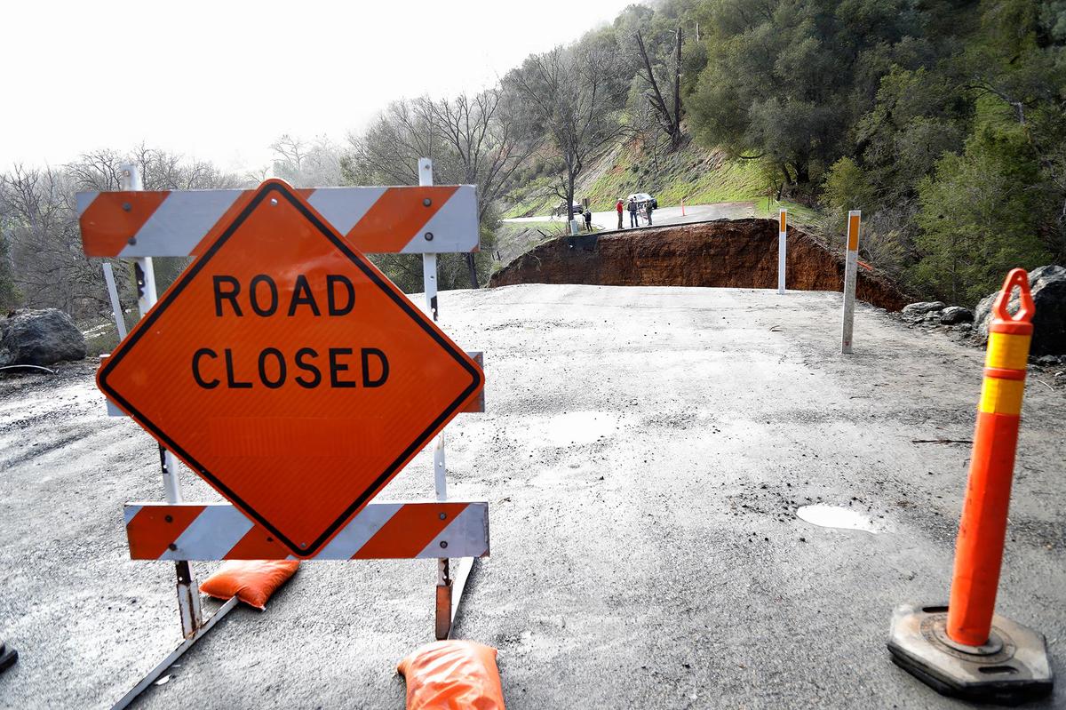 Signs block access to a section of Chimney Rock Road northwest of Paso Robles on Saturday, March 11, 2023. The road washed out during the latest atmospheric river storm to hit San Luis Obispo County, stranding about 100 residents.