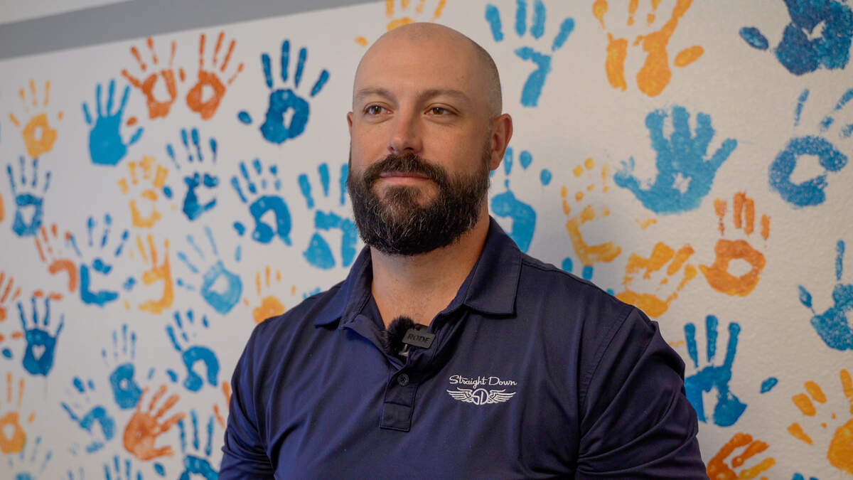 El Camino Homeless Organization director of operations and development Austin Solheim stands in a community room at ECHO’s Atascadero shelter on Tuesday, July 30, 2024.