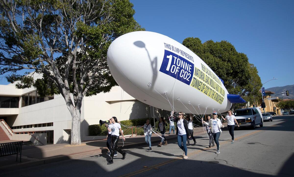 A “Save Clean Energy” rally held on Saturday, Dec. 4, 2021, in San Luis Obispo called for keeping Diablo Canyon nuclear power plant open. Group members walked a miniature blimp down Monterey Street.