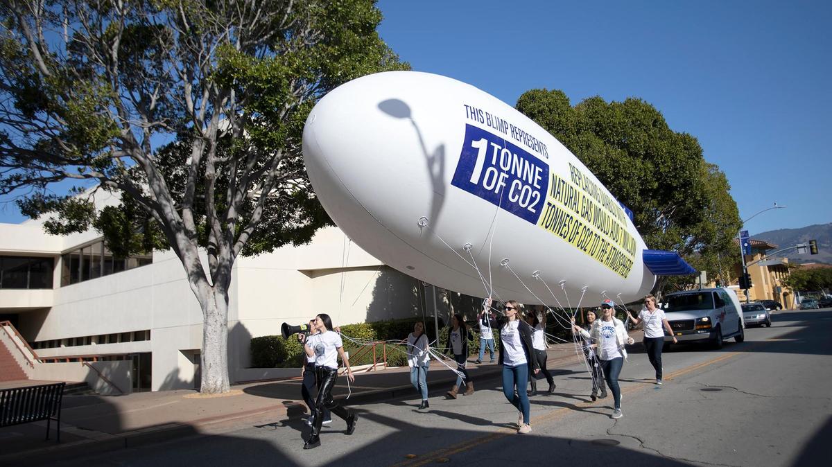 A “Save Clean Energy” rally held on Saturday, Dec. 4, 2021, in San Luis Obispo called for keeping Diablo Canyon nuclear power plant open. Group members walked a miniature blimp down Monterey Street.