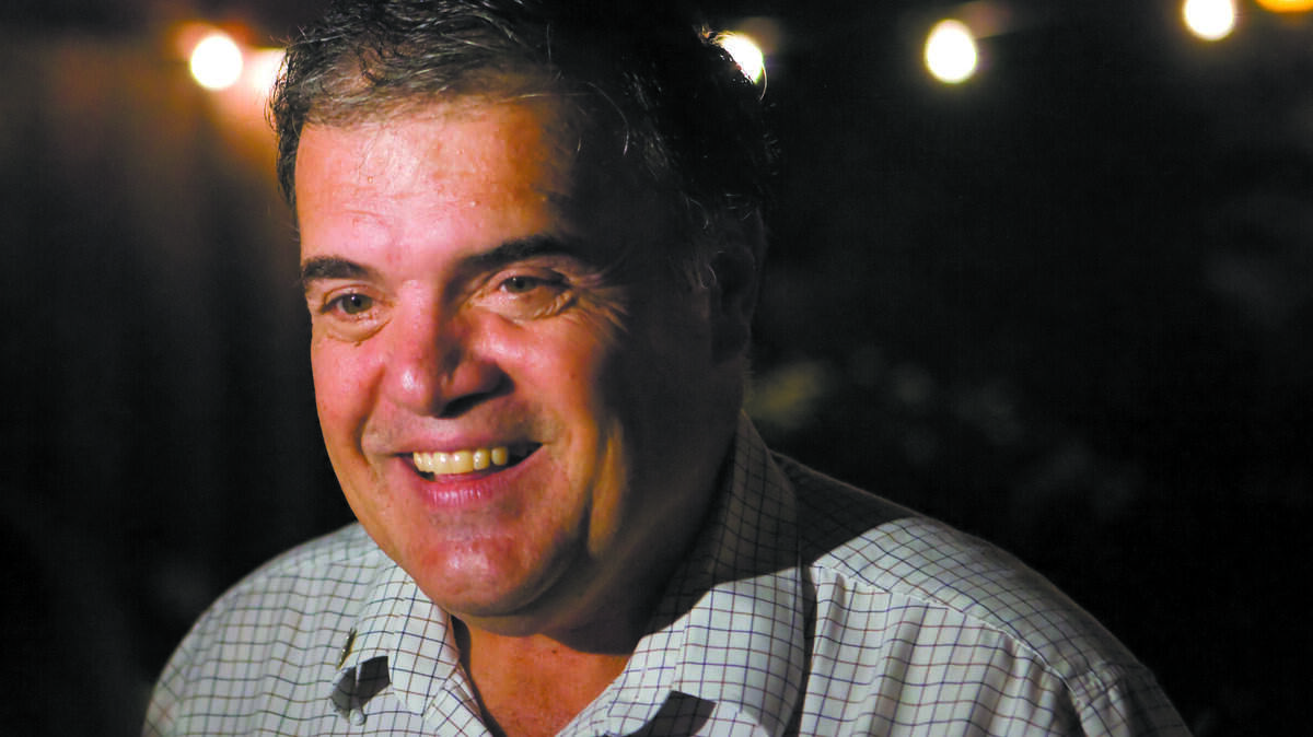 Paul Teixeira talks to a guest at his party in Nipomo after the election in 2010.