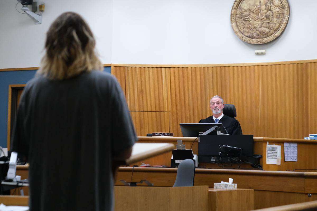 Carrie Young, left, gives her victim impact statement to San Luis Obispo Superior Court Judge Michael Frye at James Peter Thomas’ sentencing in San Luis Obispo Superior Court on June 5, 2024. Thomas pleaded no contest to the misdemeanor sexual battery of Young in May 2023.