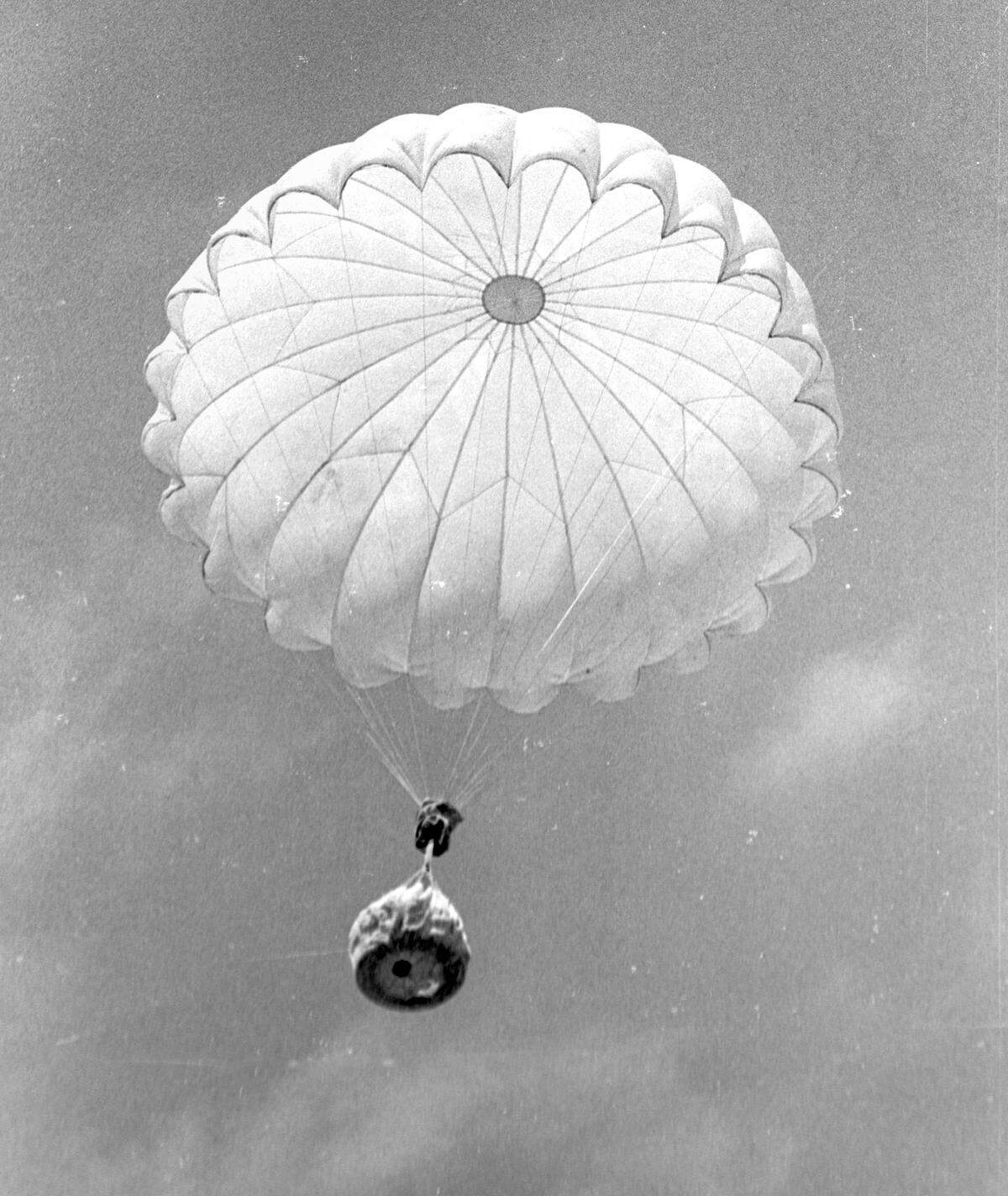 Helicopter makes a parachute drop of supplies during firefighting training. Helitack crew trains near Pozo seen here on July 17, 1967
