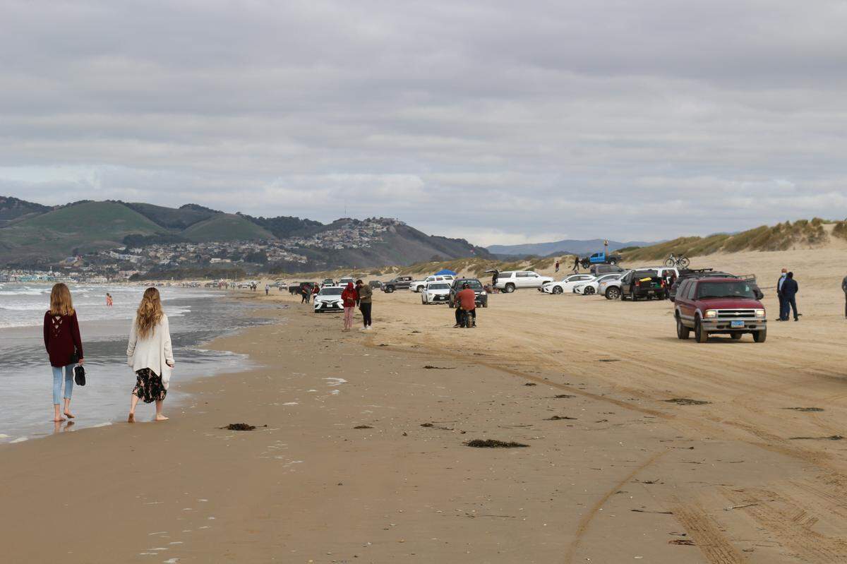 Pedestrians and drivers navigate the Oceano Dunes SVRA on Sunday, March 14.