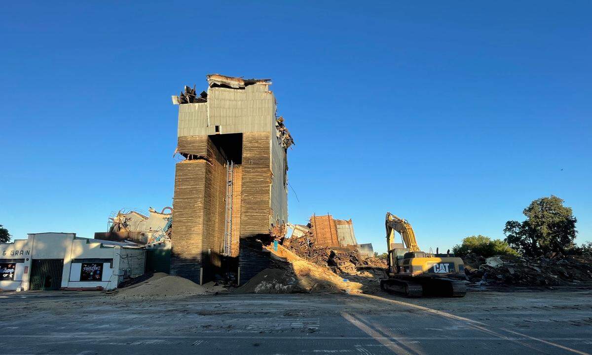 The northern tower of the Templeton Feed and Grain stands alone on Tuesday, July 8, before a demotion team brought the building down later that day.