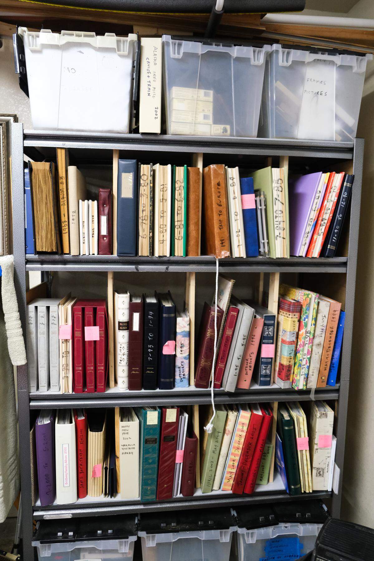 Carol Goldberg stores about 60 photo albums of memories with her husband and children in her garage on Jan. 8, 2025.