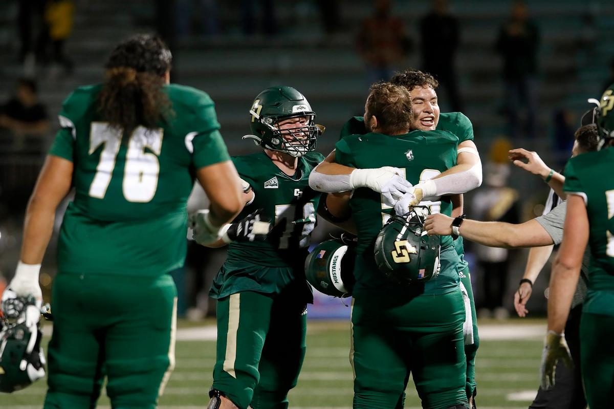 Cal Poly players congratulate each other after winning their season finale. Cal Poly beat Portland State 49-42 to earn their first and only Big Sky win of the season on Saturday, Nov. 19, 2022, at Alex G Spanos Stadium in San Luis Obispo.