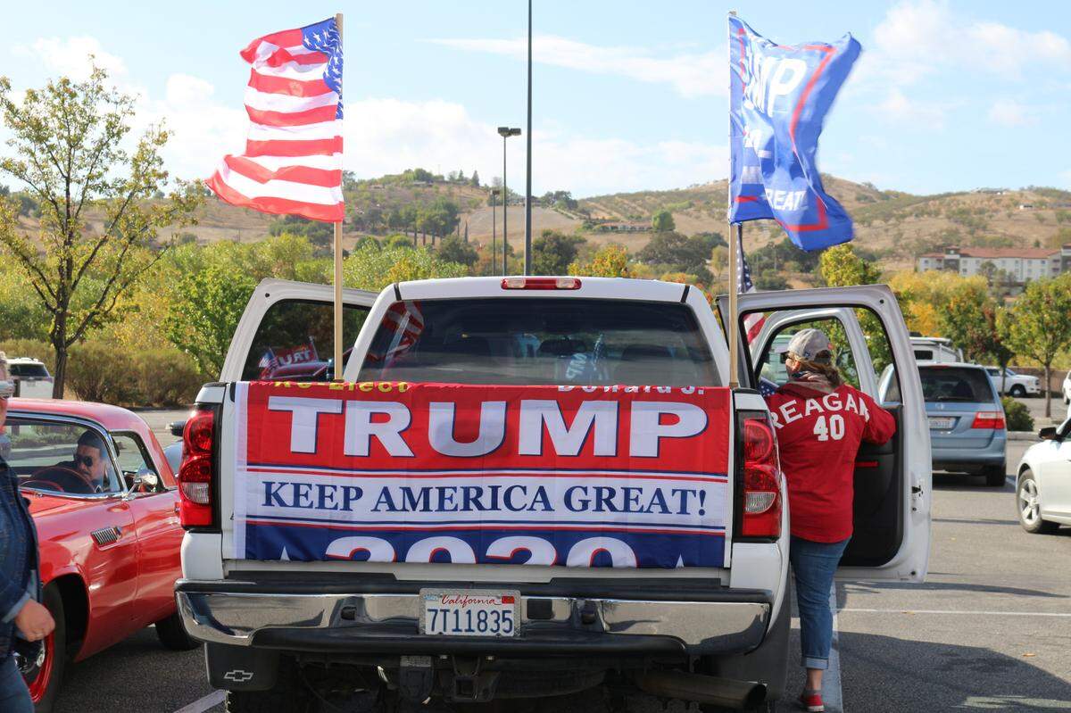 Supporters of President Donald Trump rally at the JC Penny parking lot off Niblick Road in Paso Robles during a #StoptheSteal event on Sunday, Nov. 8, 2020.