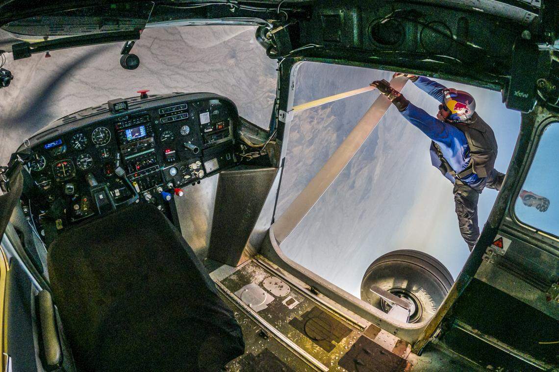 Pilot Luke Aikins is seen successfully entering the silver plane, during Plane Swap in Eloy, Arizona on April 24, 2022.