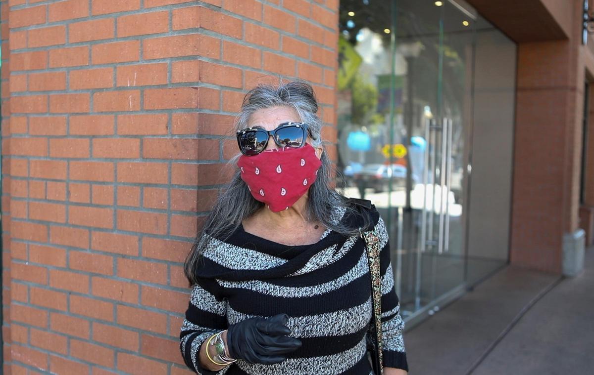 Bonnie DeSantos of San Luis Obispo wears an improvised mask consisting of a bandanna with coffee filters underneath.