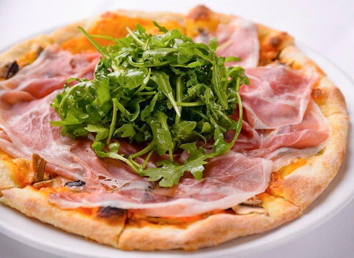 Pizza with prosciutto and arugula from Café Roma in San Luis Obispo.