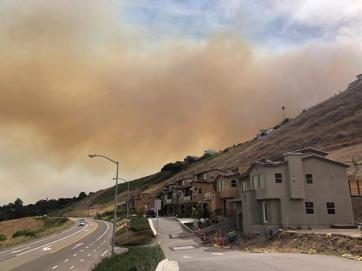 Smoke fills the skies above Price Canyon Road and Canyon Lane in San Luis Obispo on Monday, June 15, 2020.
