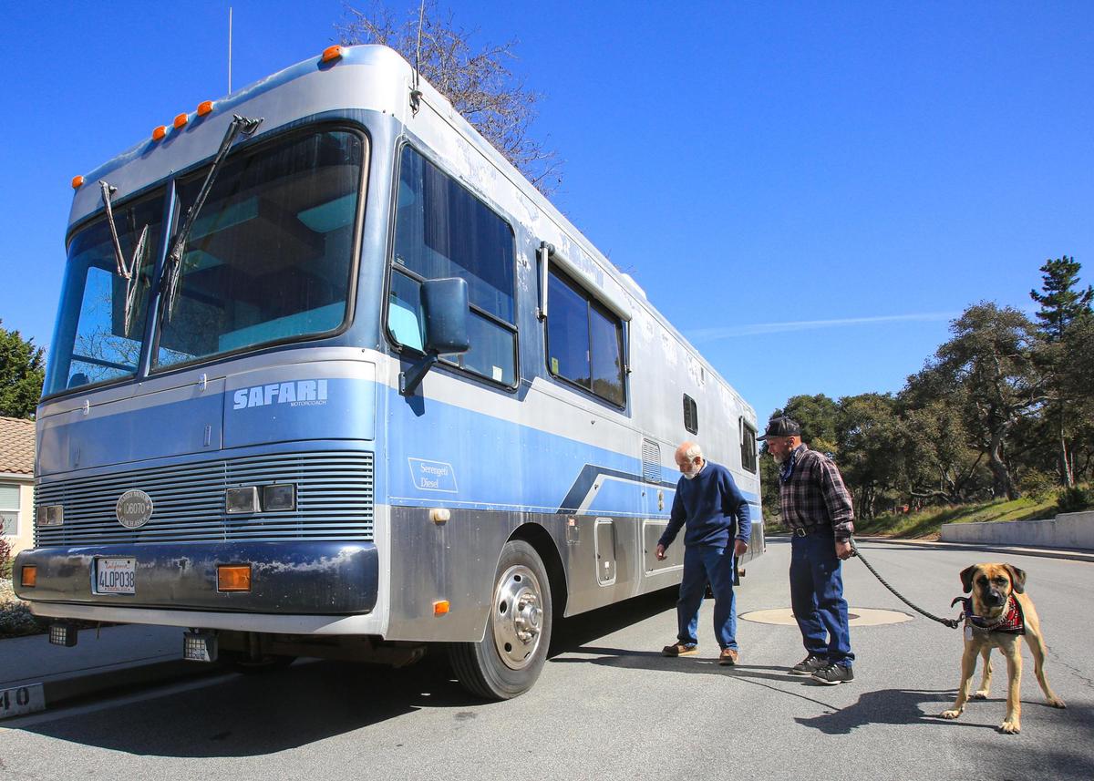 Hugh Robinson of Nipomo gave his motor home to Billy Tosch after Tosch lost his RV in a fire in Paso Robles. Here, Robinson, left, shows Tosch where things are located on the motor home.