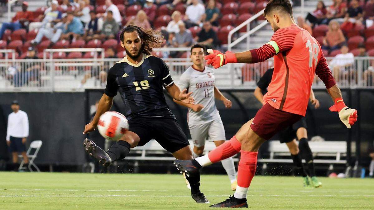 Cal Poly’s Emmanuel Perez controls the ball against a Santa Clara keeper in a previous match. Perez scored the Mustangs’ sole goal of a game against UC San Diego on Oct. 6, tying Cal Poly with UC Santa Barbara as Big West leaders.