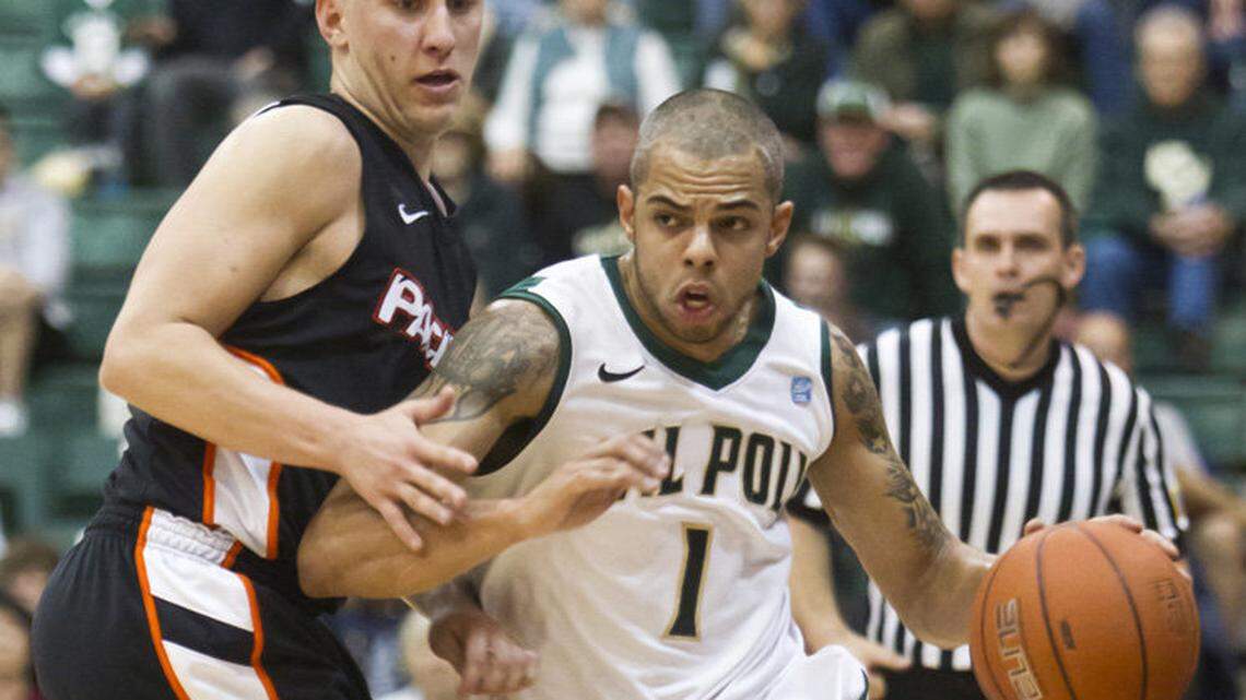 Cal Poly's Amaurys Fermin, right, who started 33 games for the Mustangs last season and led the Big West Conference in assists, has signed a contract to play professional basketball in the Dominican Republic.
