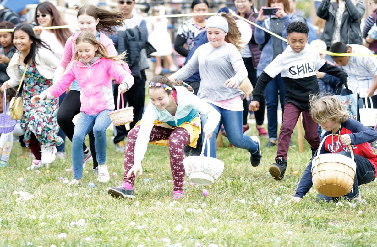 Kids dash to pick up eggs at the Pismo Beach Easter Egg-Stravaganza at Dinosaur Caves Park in Pismo Beach in 2019. Egg hunts are scheduled across San Luis Obispo County in March 2024.