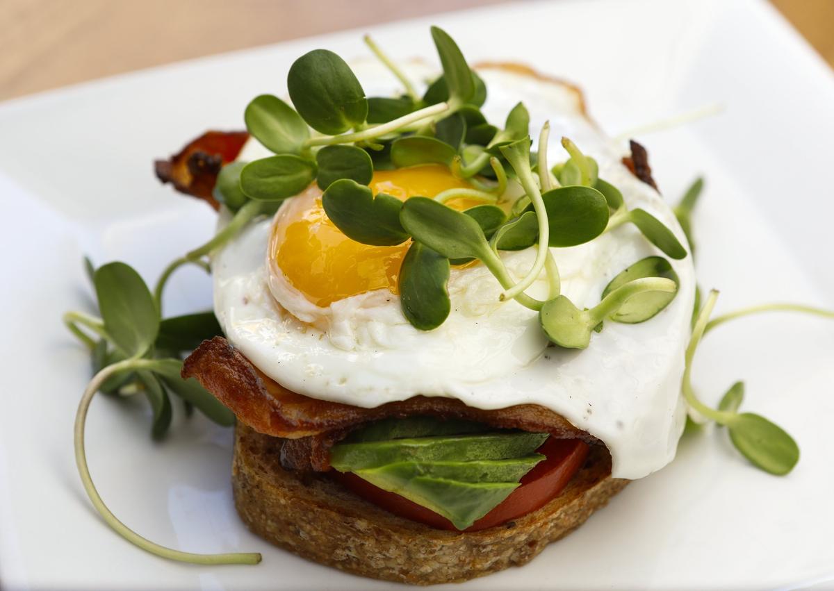 The Obispo breakfast toastie is served with whole grain bread, applewood-smoked bacon, tomatoes, avocado and egg at Mint + Craft Cafe and Mercantile in San Luis Obispo.