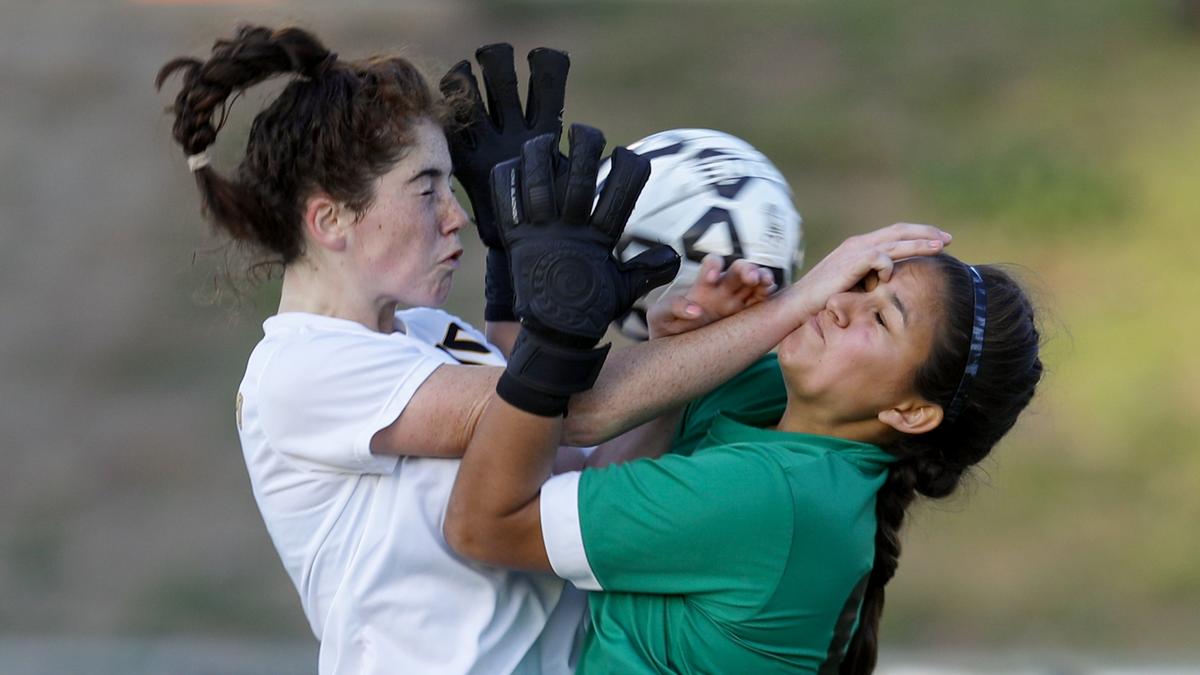 In a March game, Frankie Phelan of San Luis Obispo High School put the ball in the net, but the goal was called back for interference with Sunny Hills keeper Priscilla Avila.