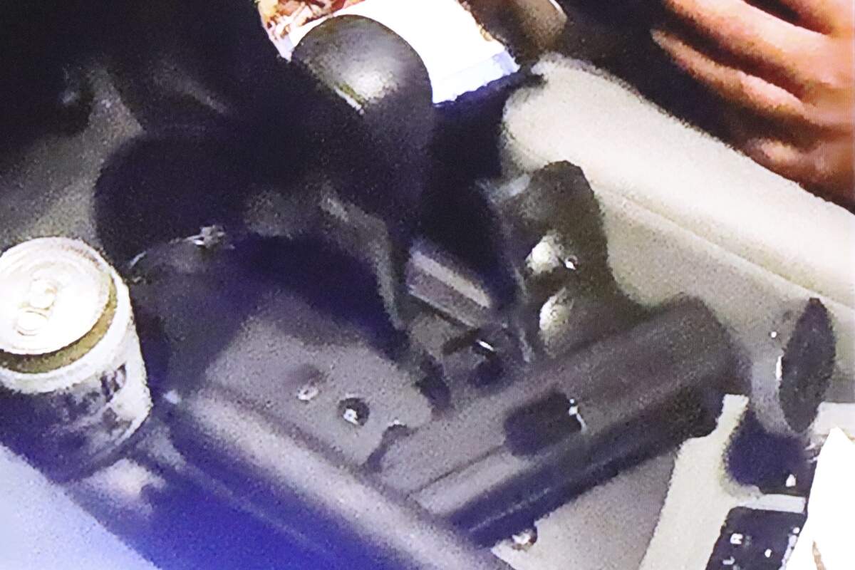 A video shown as evidence during the preliminary hearing of Abel Angel Santiago, who is accused of accessory to murder, on July 8, 2026, showed a handgun in his vehicle on the night of the alleged murder.