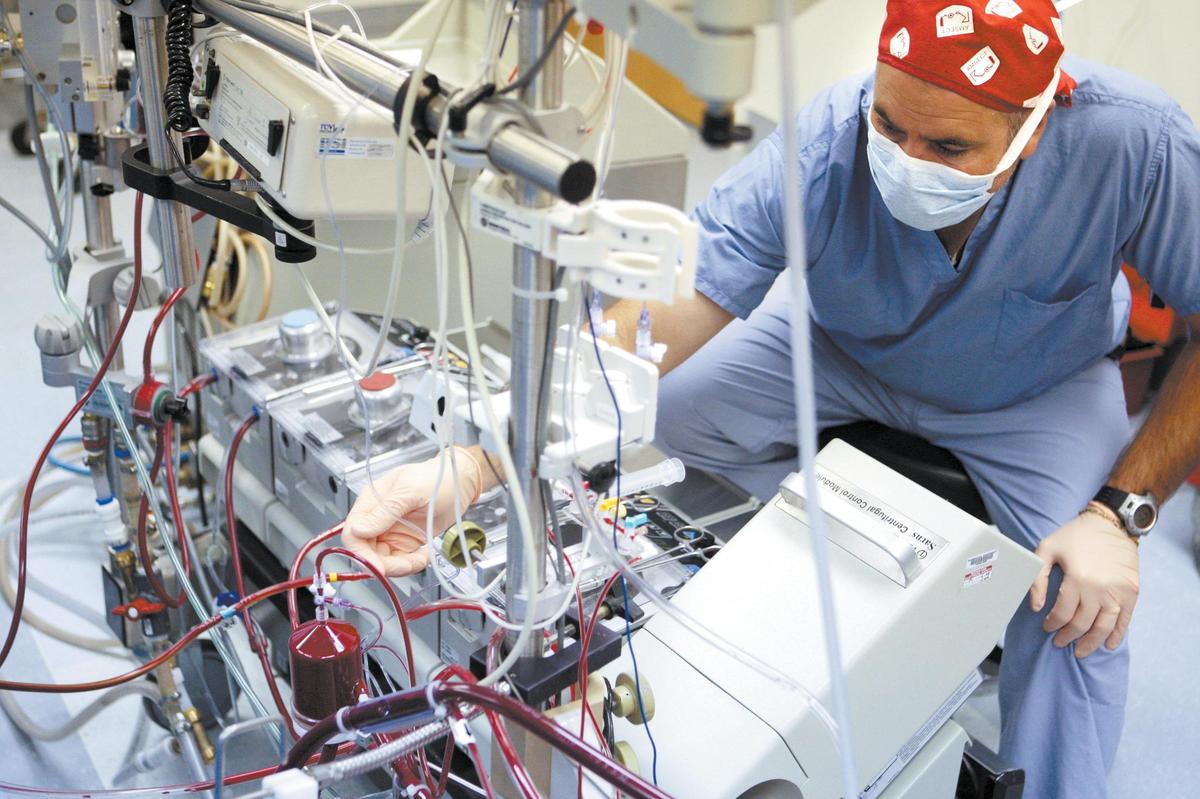 Perfusionist Mike Daily monitors the heart-lung machine during heart bypass surgery at French Hospital on June 25, 2008.