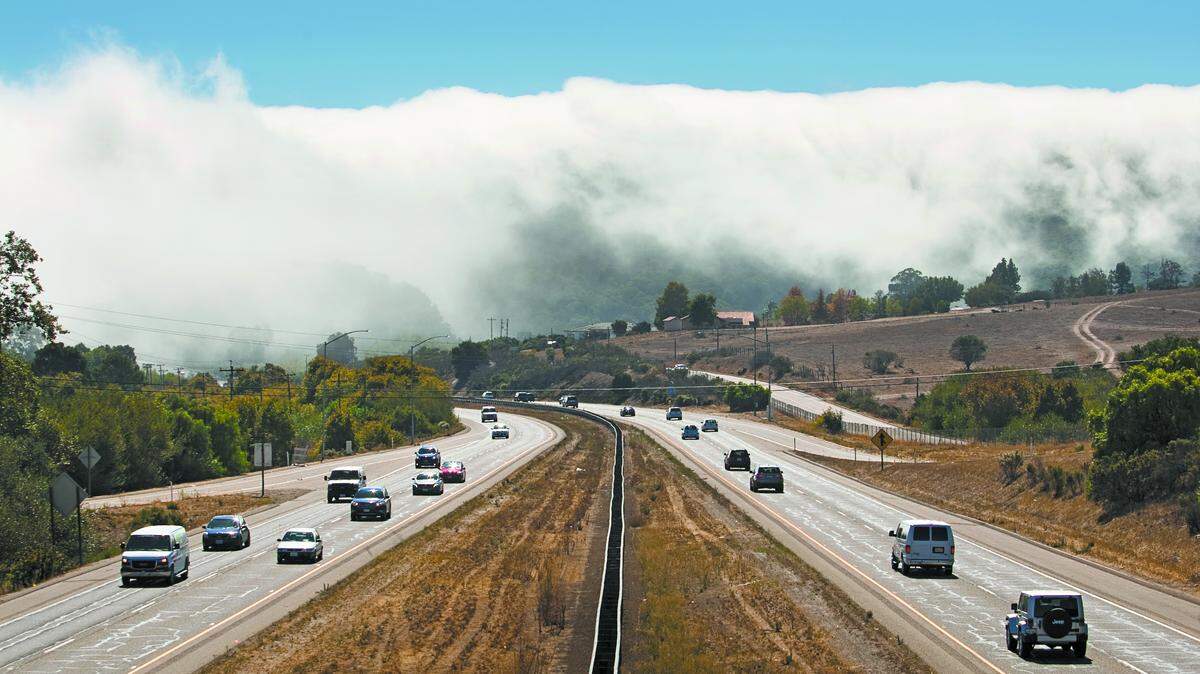 Drivers make their way down Highway 101.