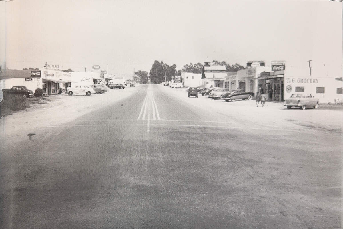 A mid-1950s photograph looking east from 11th Street shows eucalyptus trees lining West Grand Avenue in Grover Beach.