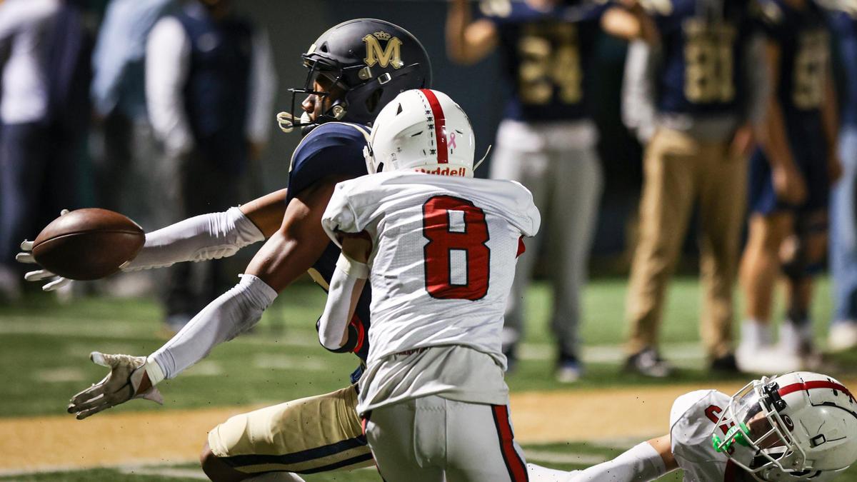 Jayden Nozil makes an acrobatic catch after the ball was knocked loose by defenders Angel Guerra (8) and Talen Freitas (3). Mission Prep beat Paso Robles 26-16 in a high school football game on Oct. 25, 2024.