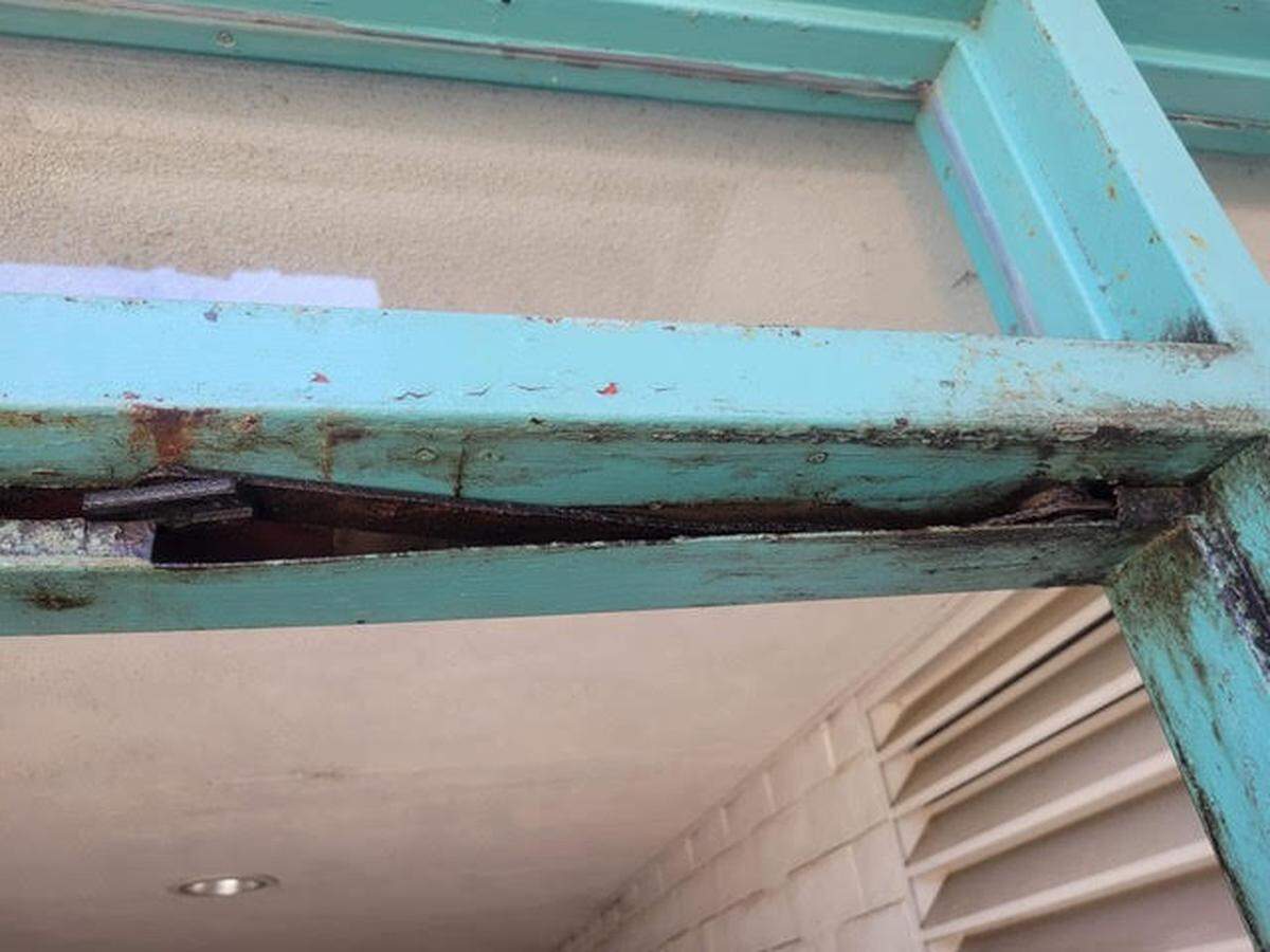 Broken door frames like this one at Hawthorne Elementary School must be replaced before more secure doors can be installed.