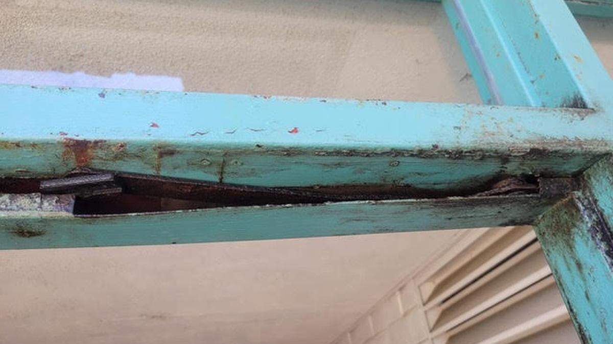 Broken window and door frames like this one at Los Osos Middle School are overdue for replacement.