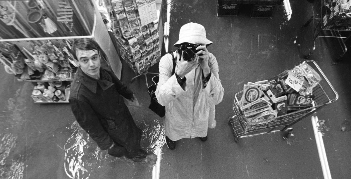 Telegram-Tribune photographer Wayne Nicholls, right, takes a selfie in a store mirror, flooded in January 1973. This is probably the ADX Drugstore.Telegram-Tribune/Wayne Nicholls1-18-1973