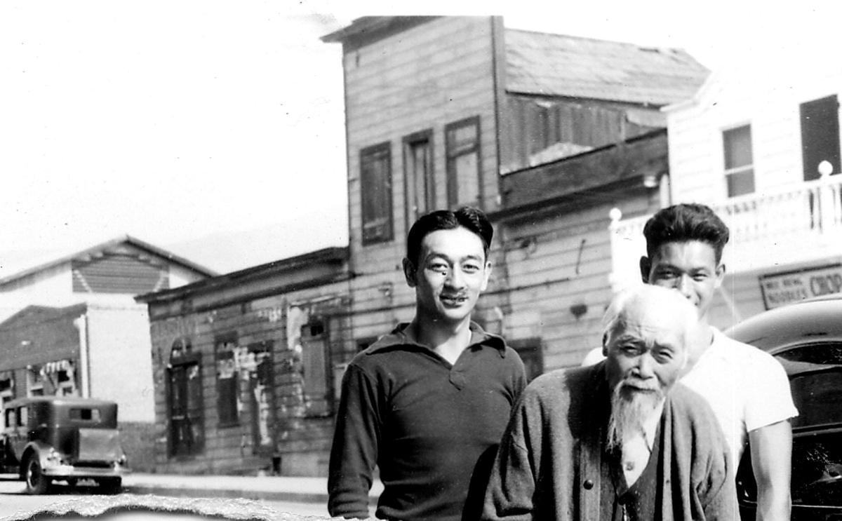 Howard Louis and his father, Ah Louis, stand in San Luis Obispo’s Chinatown (what is now Palm Street near Morro Street) in 1936.
