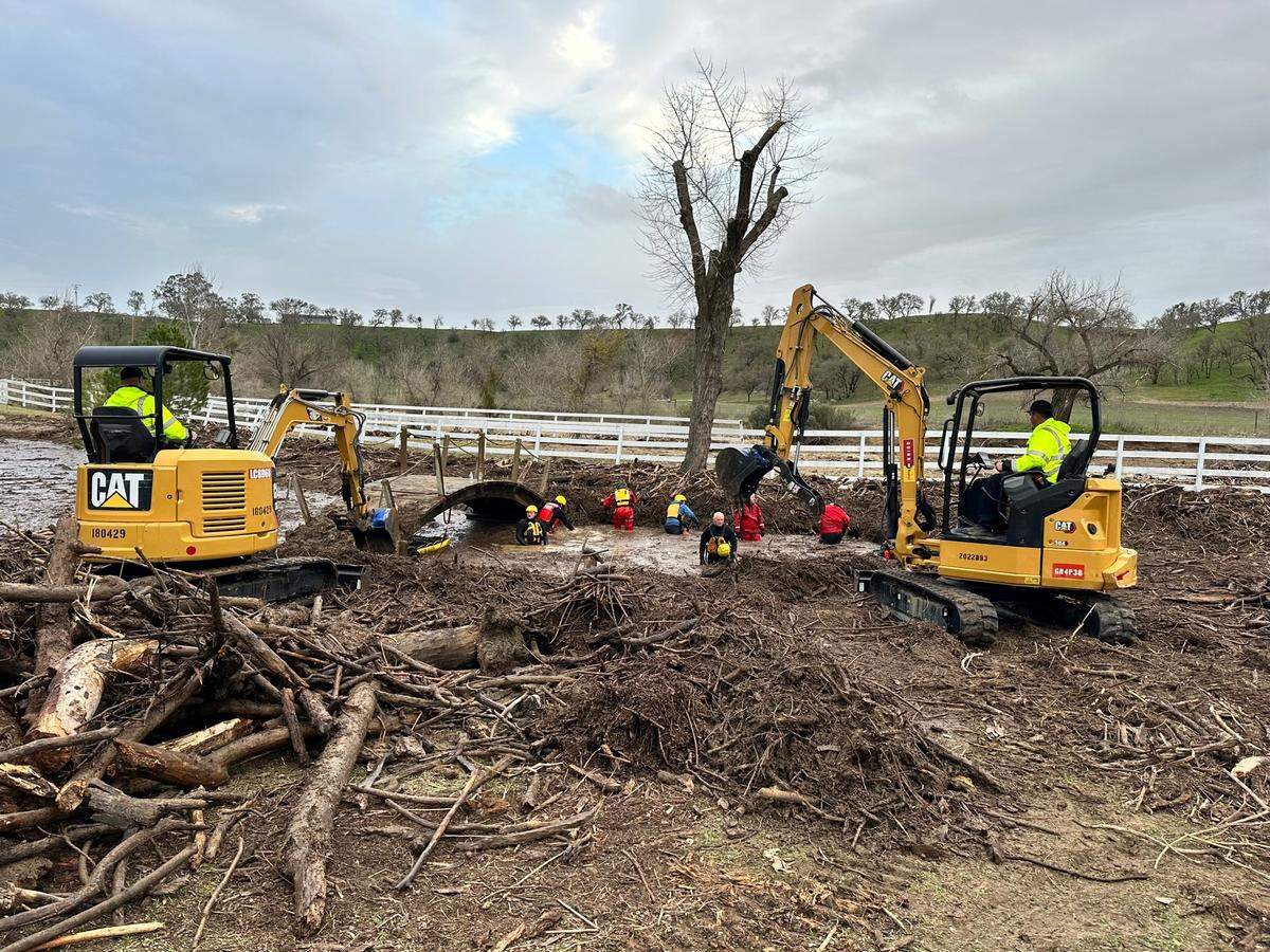 Search teams look for 5-year-old Kyle Doan, who went missing Jan. 9, 2023, near San Miguel when he was carried away by floodwaters. Doan has not been found after three days of searching.