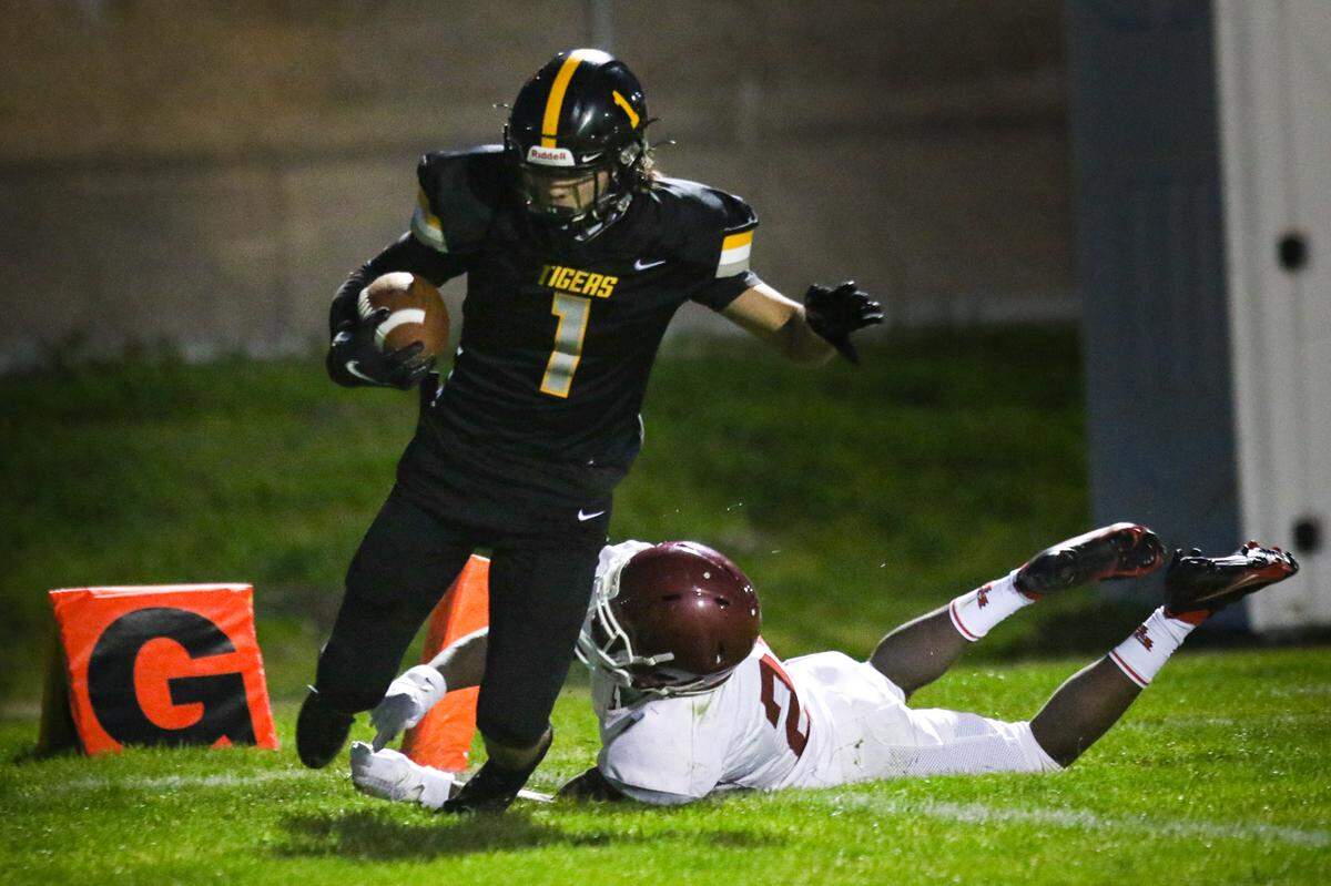 Blayke Perry scores a touchdown on a long catch and run in March. San Luis Obispo hosted Paso Robles for the second game of the coronavirus-shortened spring football season.
