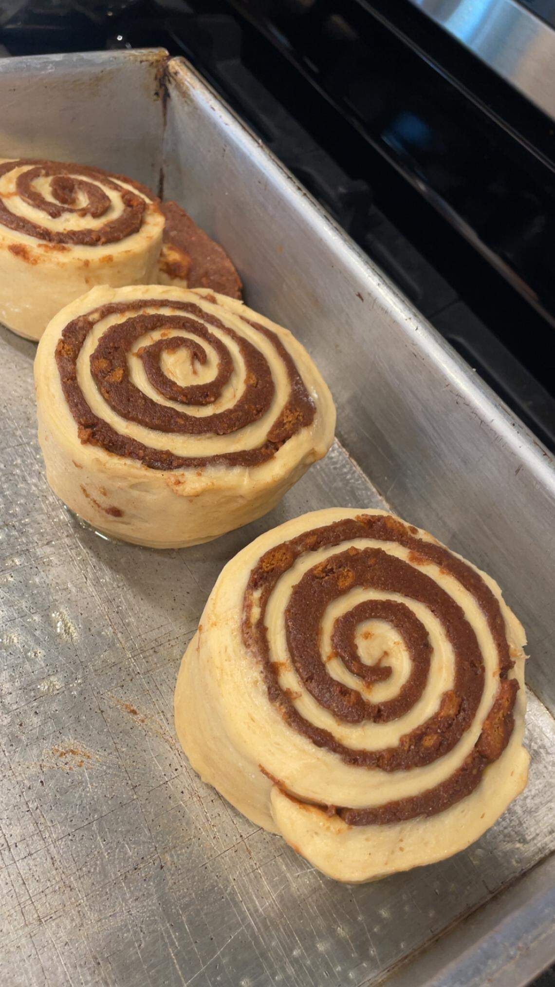 Roll’d SLO owner and chef Shannon Ocana makes all her enormous cinnamon rolls from scratch, seen here about to enter the oven to be baked.