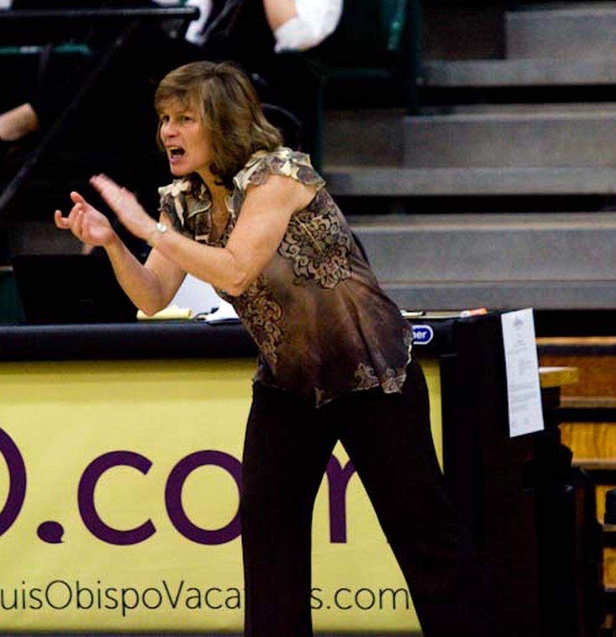 Coach Faith Mimnaugh cheers on the players during Cal Poly’s 75-71 win over CSU Bakersfield in a non-conference game at Mott Gym on Sunday, Nov. 25, 2012.