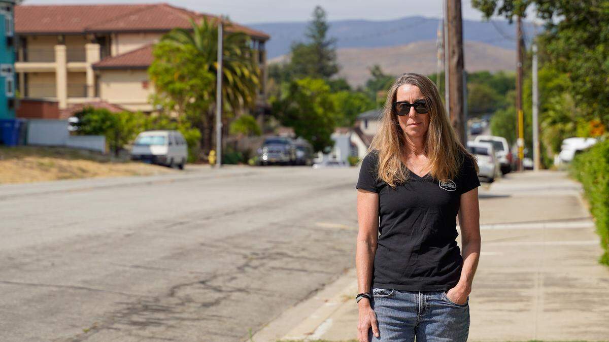 Lynn Hamilton, a teacher at Cal Poly and resident of Palm Street near the San Luis Obispo Veterans Hall, stands near the location of a proposed interim safe parking site. The parking site would occupy around 200 feet of street between the entrance to the Veterans Hall parking lot and Grand Avenue between 7 p.m. and 7 a.m.