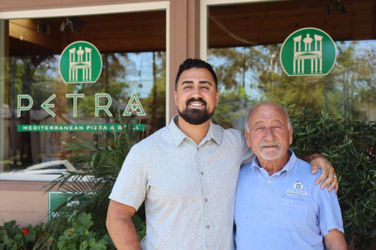 Petra owner Todd Aburashed, right, with his son Rammy, the restaurant’s director of operations.
