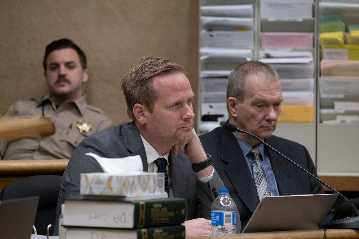 Tim Osman (center) listens during the trial against his client, Stephen Deflaun (right), in San Luis Obispo Superior Court on Apr. 20, 2023.
