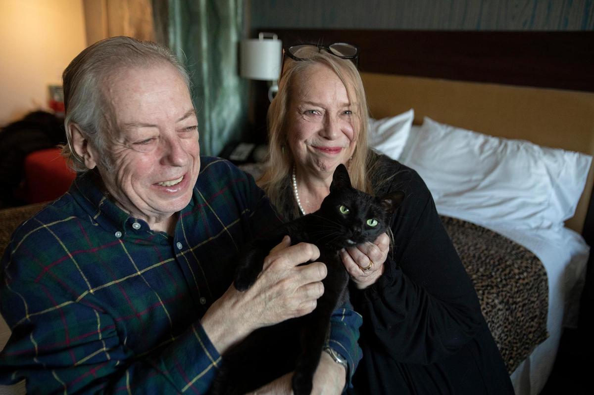 When Tobey Crockett, right, and Mark Onspaugh were unable to find housing in SLO County, they began living in Home2 Suites by Hilton in Atascadero. They’re pictured with one of their three cats, Shadow Lass.