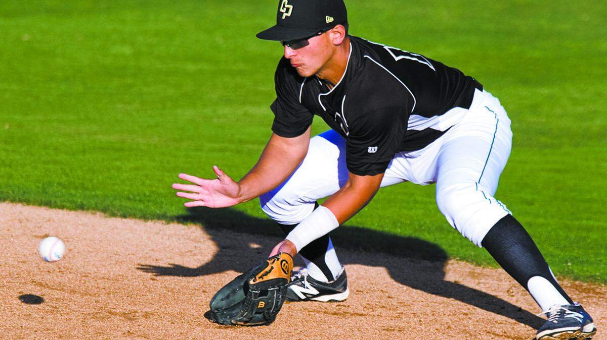 Cal Poly’s Mark Mathias grabs a ground ball and turns an out against San Jose State during a 2014 game at Baggett Stadium.