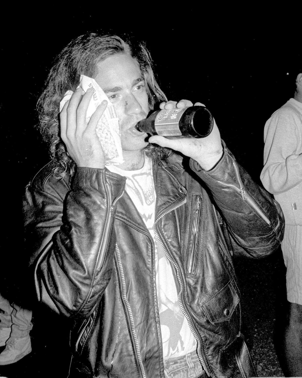 Peter Doctors, 24, a design engineer from Ventura and a Cal Poly alumnus, ices his face with a bag of frozen corn. Doctors said he was punched by a man after he ‘suggested it was inappropriate’ for him to throw bottles at cars during Poly Royal in 1990. The hurler’s friends then jumped Doctors, but he said he was able to get away.