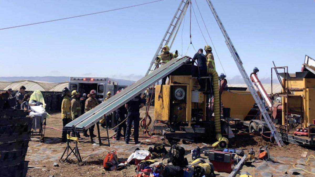 Cal Fire firefighters work to rescue a man caught in an industrial mulcher in Nipomo on Aug. 29, 2025.