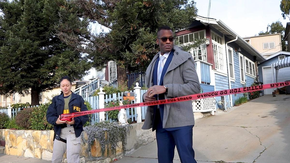 Representatives of the San Luis Obispo County Sheriff’s Office and FBI conduct a warrant search of the Flores house in the 500 block of East Branch on Wednesday morning. Sheriff’s Office Cmdr. Keith Scott, head of the detective bureau, is on the right.