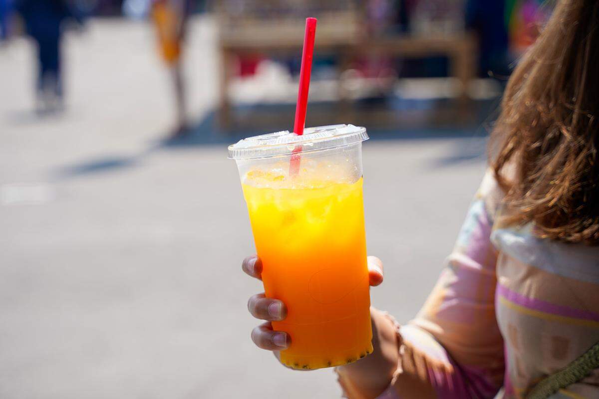 Tribune reporter Hannah Poukish holds a mango beverage she purchased at the Nipomo Swap Meet on Sunday, Aug. 10, 2025. The Swap Meet features more than 300 vendors, the largest market of its kind on the Central Coast.